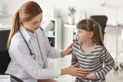 Gastroenterologist_Examining_Little_Girl_in_Clinic_480x320_Q50